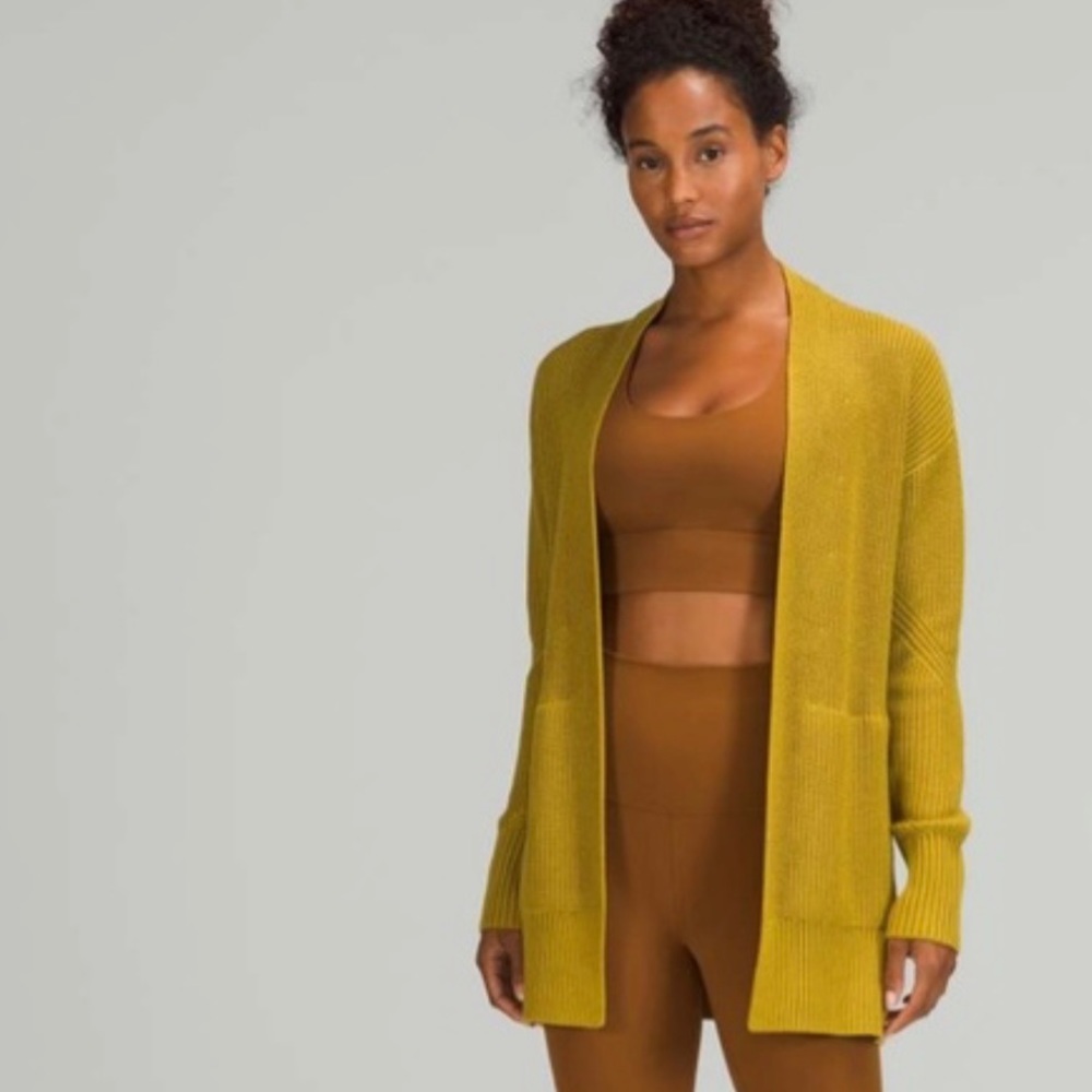 SOLD!!!!Never worn and sold out LuLu Lemon sweater!!